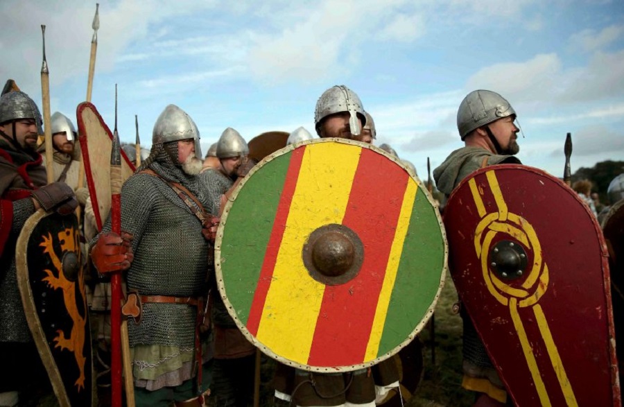 Re-enactors participate in a re-enactment of the Battle of Hastings in Battle